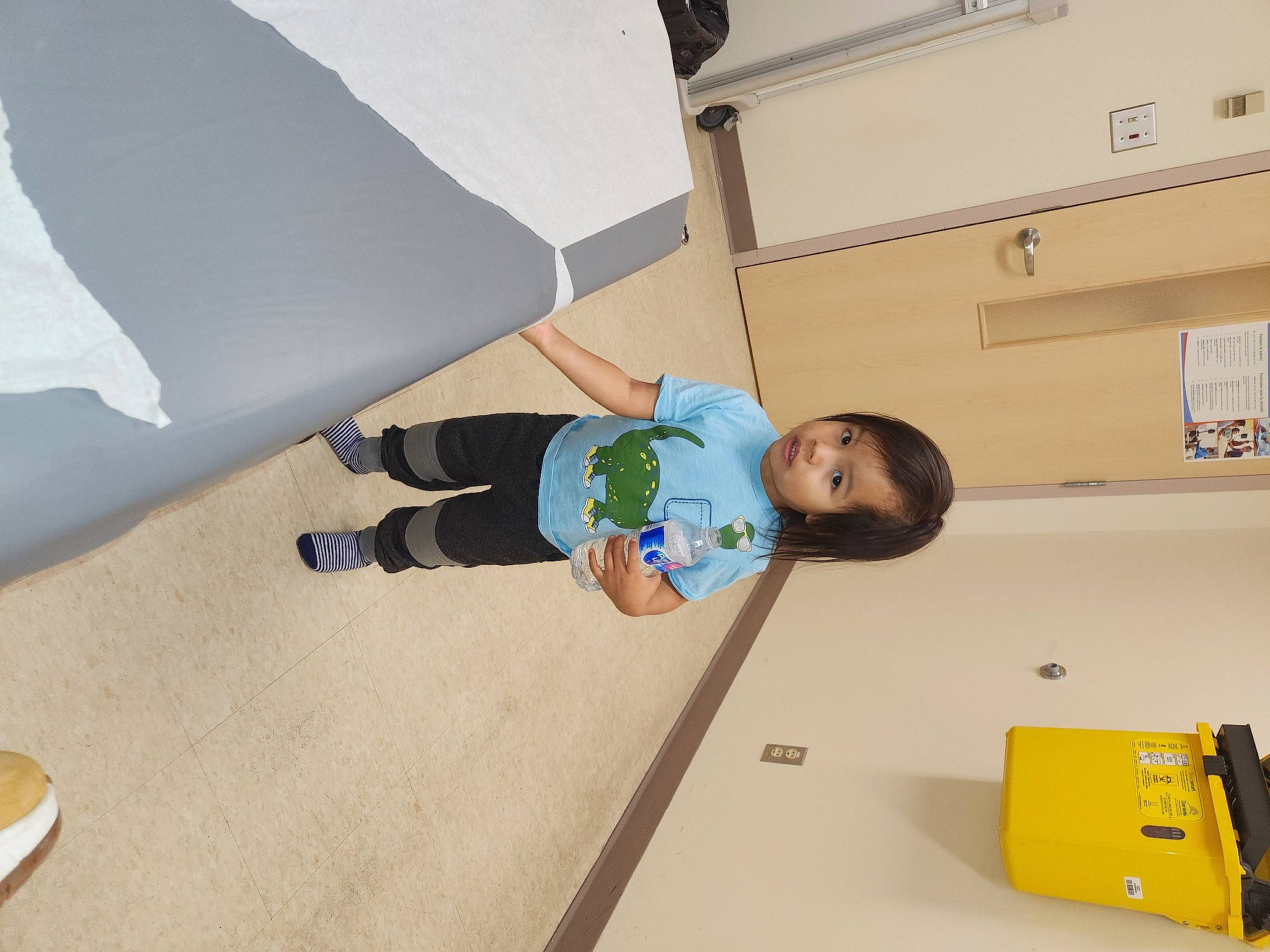 Alaric is registered to the contest to win money with this photo: baby, baby_products, baby_safety, baby_toddler_clothing, child, comfort, floor, flooring, fun, hardwood, house, person, product, room, sleeve, t_shirt, toddler, wood, yellow