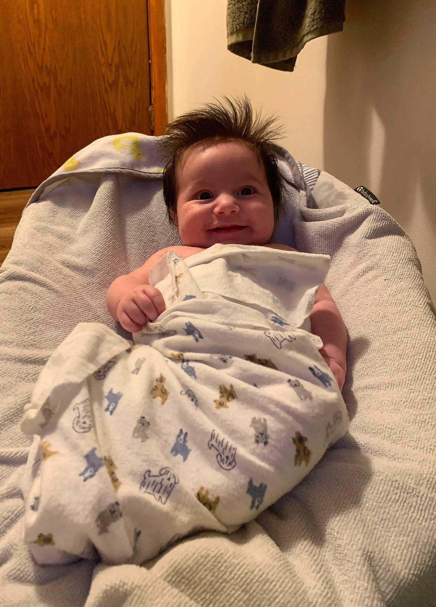 Cassius is registered to the contest to win money with this photo: abdomen, arm, baby, baby_toddler_clothing, bedding, bedtime, cheek, chest, child, comfort, elbow, human_body, human_leg, joy, linens, nap, person, room, sitting, smile