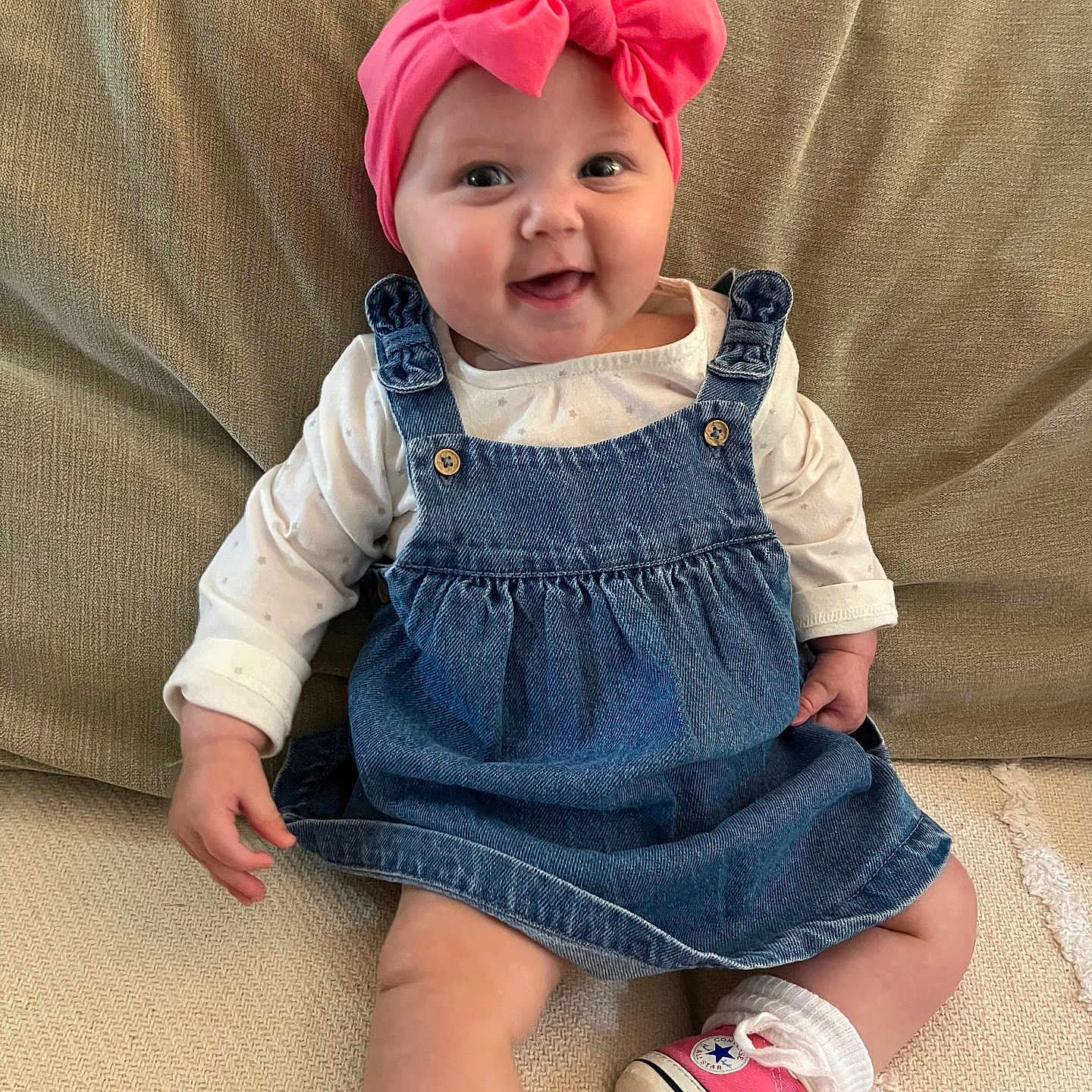 Arwyn joined the competition — help win amazing prizes! baby, babylaughing, clothing, couch, dress, face, footwear, furniture, happy, hat, head, jeans, pants, person, photography, portrait, shoe, sitting, smile, sneaker