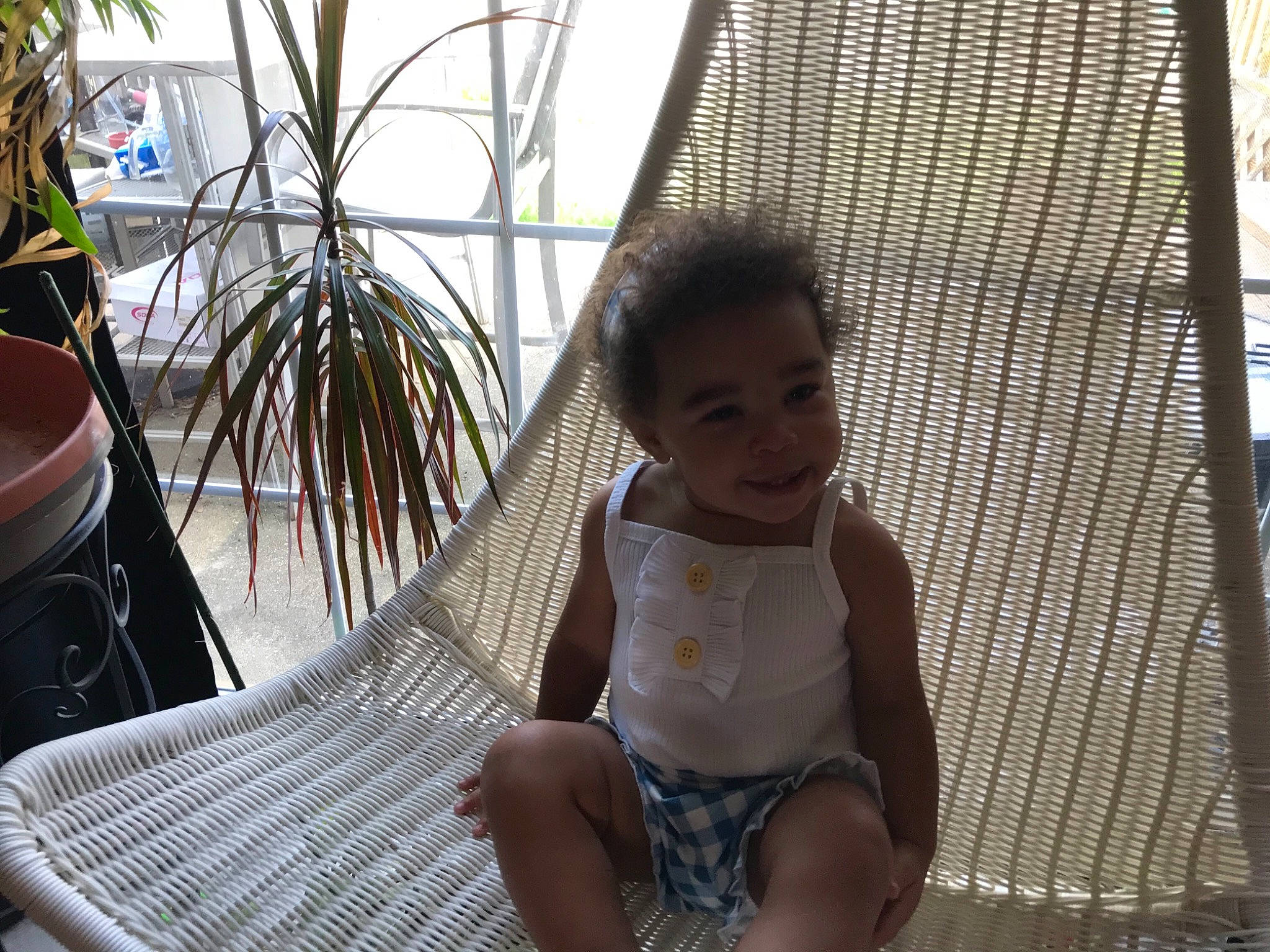 Ceaunna is registered to the contest to win money with this photo: baby, barefoot, chair, child, comfort, foot, fun, grass, happy, human_leg, leisure, outdoor_furniture, person, plant, recreation, shade, sitting, thigh, toddler, tree