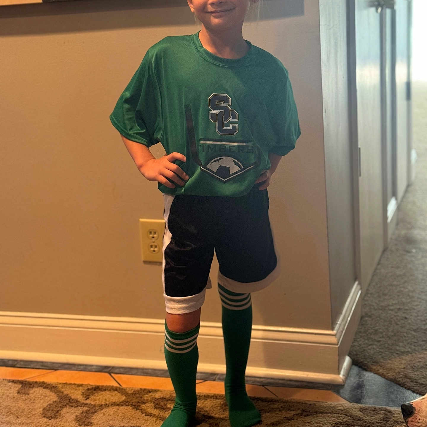 Neviah Owen is registered to the contest to win money with this photo: boy, child, clothing, costume, door, face, footwear, head, hosiery, male, pants, person, photography, portrait, shoe, shorts, sleeve, sock, standing, t_shirt