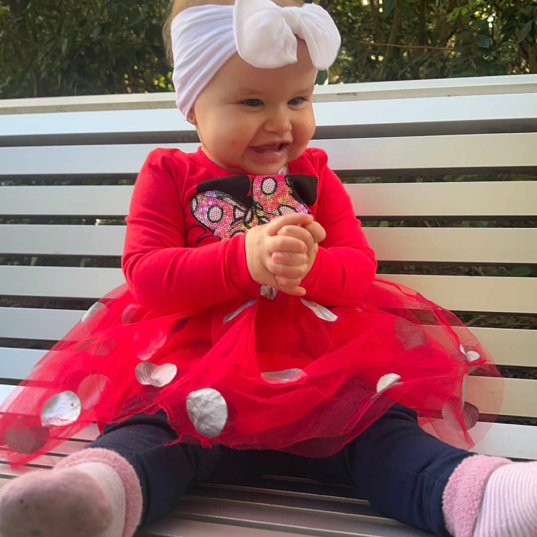 Nevaeh joined the competition — help win amazing prizes! baby, bench, clothing, coat, cream, cutlery, dessert, face, food, furniture, head, icecream, jacket, person, photography, plant, portrait, sitting, spoon, sweets