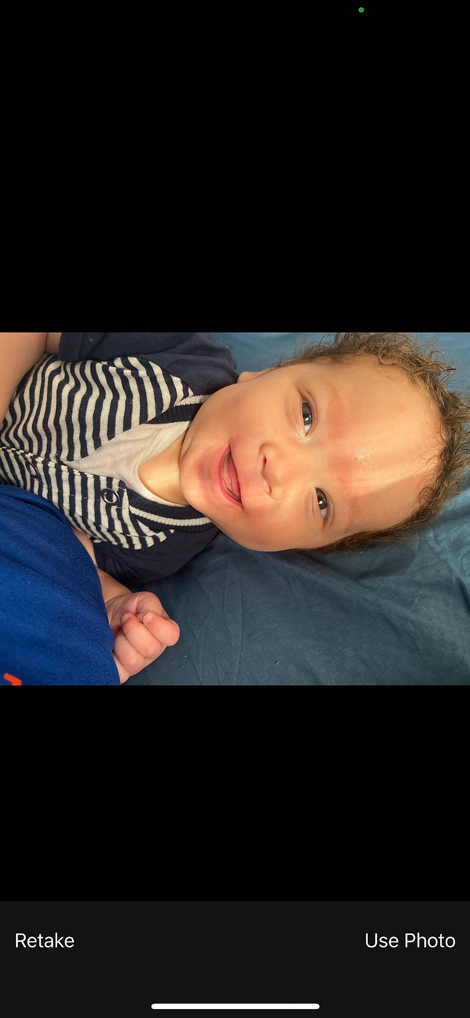 Kyle is registered to the contest to win money with this photo: baby, cheek, darkness, electric_blue, eyebrow, eyelash, flash_photography, happy, pattern, person, portrait, portrait_photography, sitting, sky, sleeve, smile, t_shirt, toddler, wood