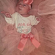 Zelyana participe au concours pour gagner de l'argent avec cette photo : baby, infant, newborn, headband, bow, pink, tulle, tutu, onesie, ribbon, lying_down, portrait, closeup, soft_texture, fabric, clothing, tiny_hands, tiny_feet, blanket, adorable