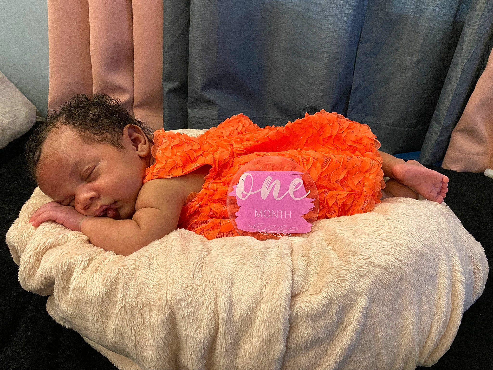Gianna is registered to the contest to win money with this photo: baby, baby_products, baby_sleeping, baby_toddler_clothing, bean_bag, bedtime, child, comfort, finger, flooring, fun, happy, nap, orange, person, red, room, sitting, textile, toddler