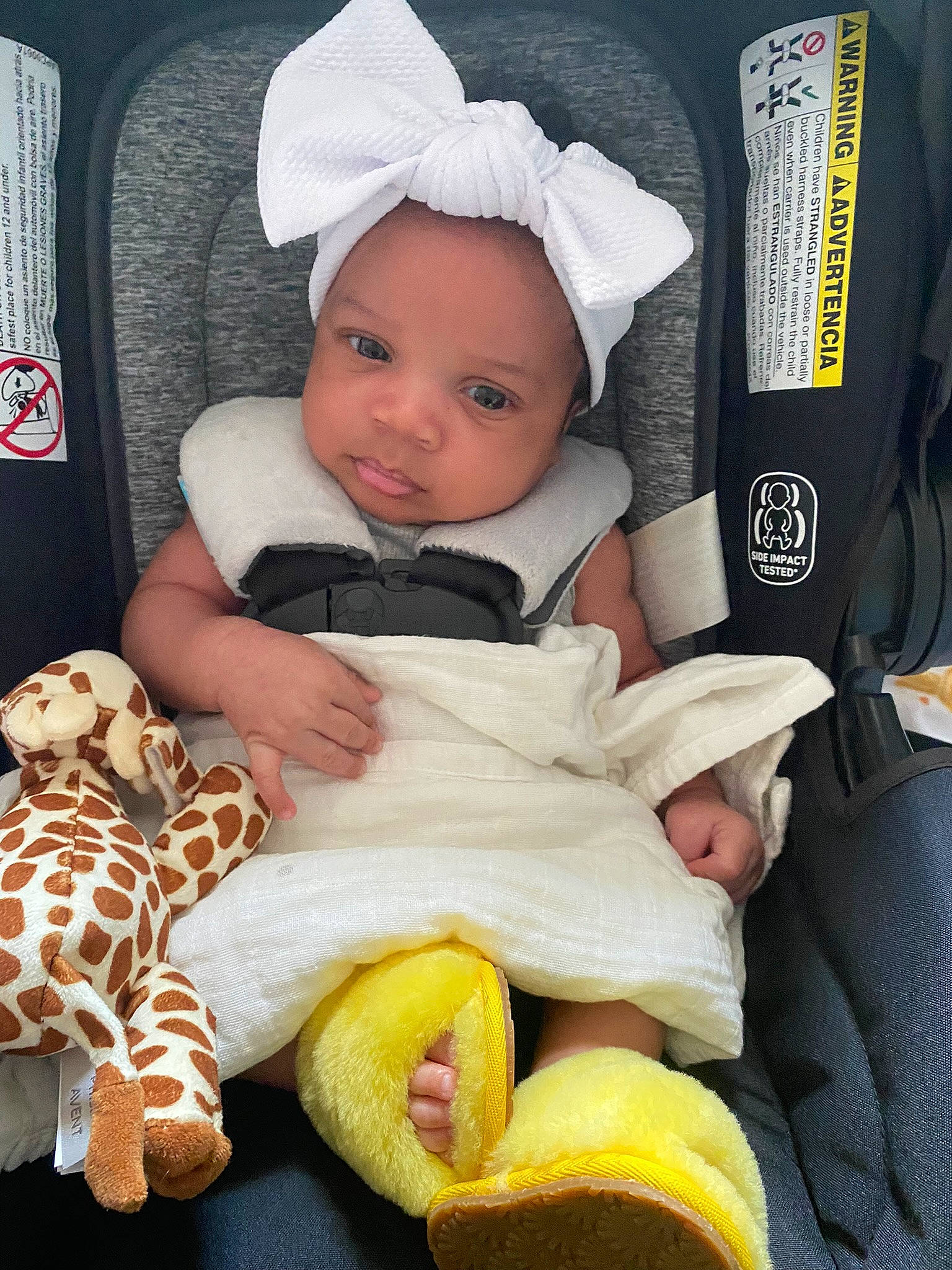 Gianna is registered to the contest to win money with this photo: baby, baby_products, baby_safety, baby_toddler_clothing, cheek, child, comfort, head, headwear, lap, linens, mammal, person, product, room, sitting, skin, sleeve, textile, toddler