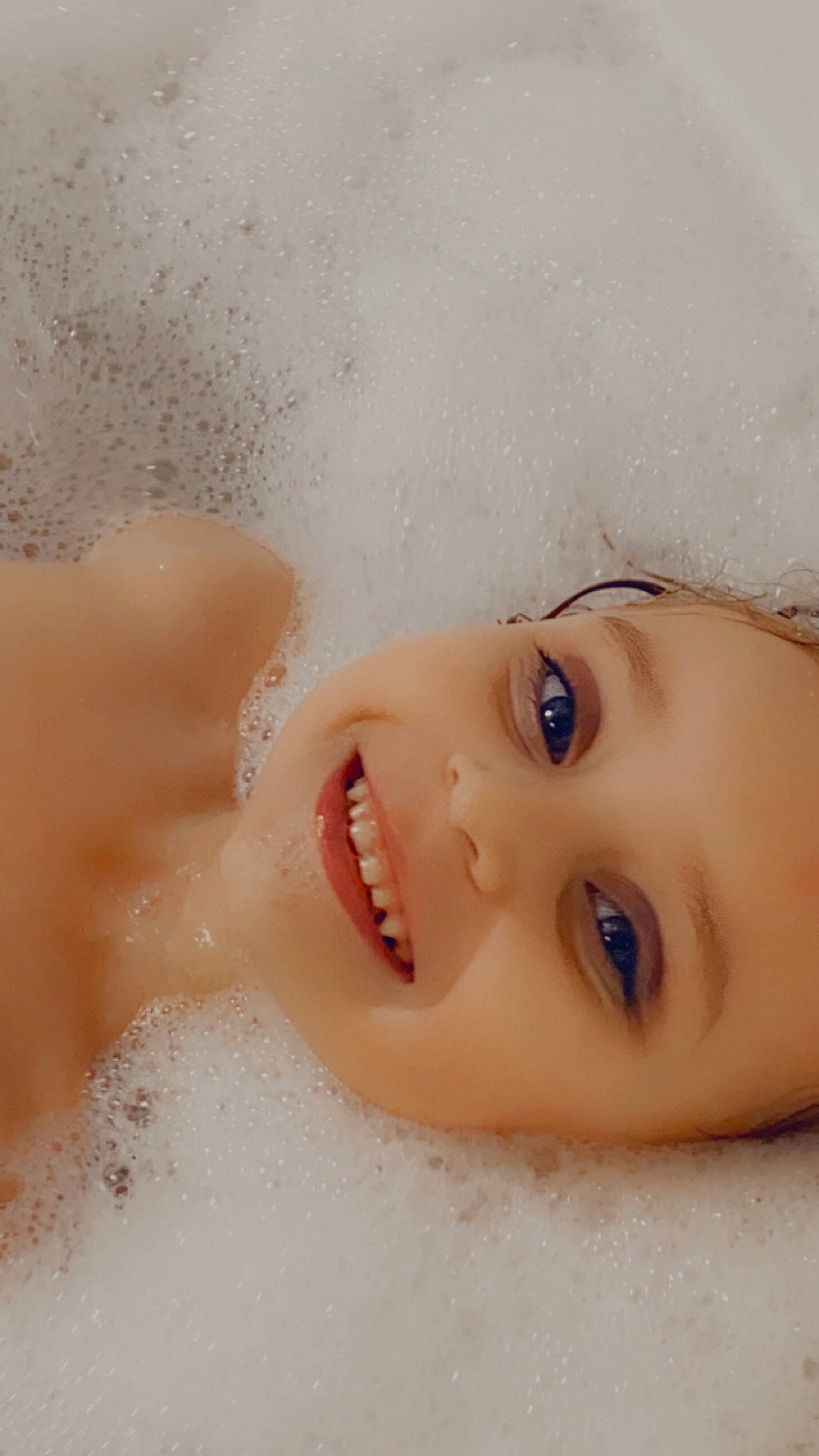 Kenzlee is registered to the contest to win money with this photo: baby, bathing, cheek, eye, eyelash, face, foam, hair, happy, head, headgear, headwear, human_body, iris, jaw, joy, lip, no_expression, nose, person