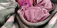 Amelia is registered to the contest to win money with this photo: baby, blanket, child, comfort, cozy, cute, face, headband, human, indoors, infant, newborn, pacifier, pink_clothing, portrait, resting, sleepwear, soft_texture, wrapped, young
