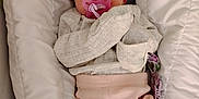 Amelia joined the competition — help win amazing prizes! newborn, baby, sleeping, pacifier, headband, floral, pink, clothing, baby_seat, padded, infant, cute, soft, pastel_colors, cozy, portrait, indoors, child, resting, peaceful