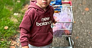 Simon joined the competition — help win amazing prizes! child, boy, toddler, portrait, outdoor, standing, shopping_cart, hoodie, sweatshirt, blond_hair, serious_expression, path, sidewalk, grass, leaves, daylight, close_up, casual_clothing, new_balance, candid