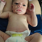 Antonio joined the competition — help win amazing prizes! arms, baby, child, closeup, cute, diaper, expression, face, human, indoors, infant, lap, legs, lying, newborn, person, raising_arms, skin, small, soft_light