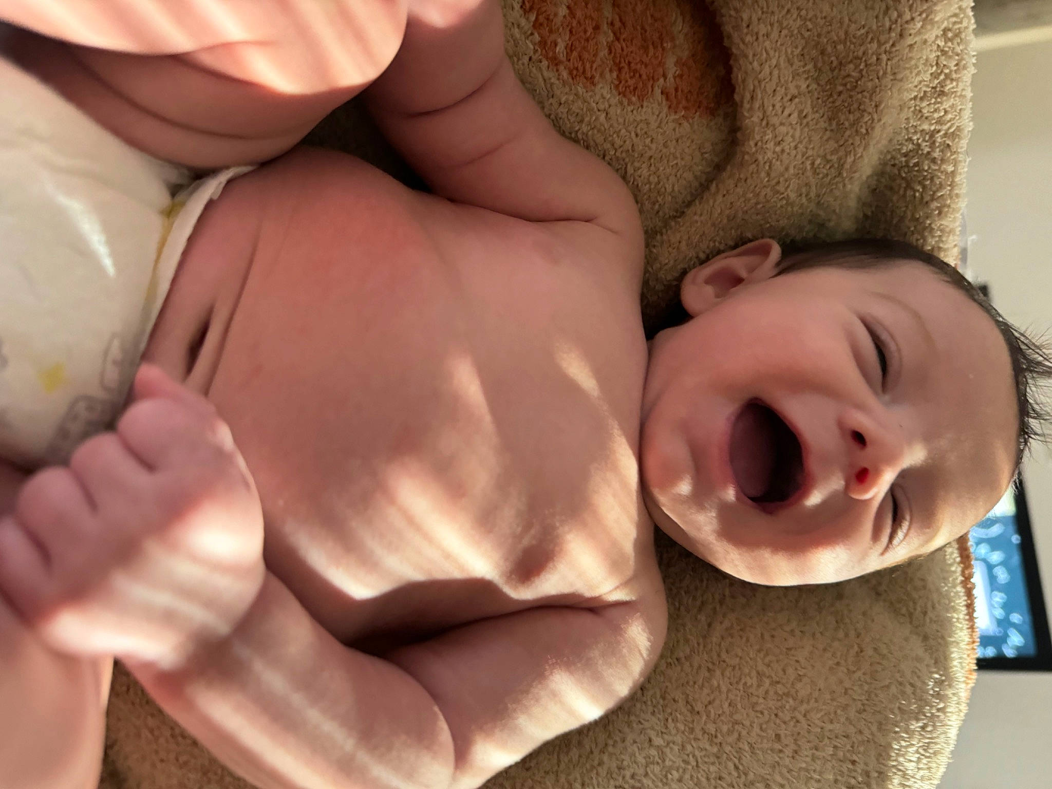 Charlie is registered to the contest to win money with this photo: arm, baby, cheek, comfort, ear, eye, eyebrow, eyelash, face, hand, head, human_body, lip, mouth, muscle, nose, organ, person, skin, smile