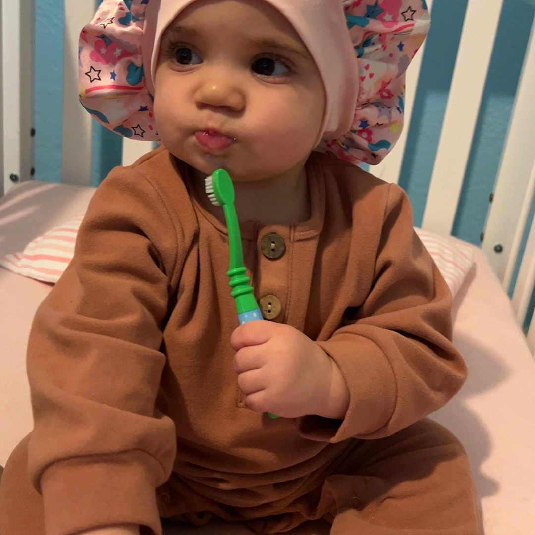 Aloy joined the competition — help win amazing prizes! baby, bodypart, bonnet, brush, cap, clothing, crib, cutlery, device, face, finger, furniture, hand, hat, head, infantbed, person, spoon, tool, toothbrush