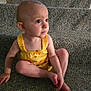 toddler, child, yellow_clothing, carpet, stairs, sitting, barefoot, indoor, portrait, cute, curious, baby, person, young_child, face, head, skin, eyes, hand, foot