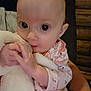 Delilah is registered to the contest to win money with this photo: baby, infant, blanket, clothing, cute, face, hand, holding, indoors, person, portrait, soft, warm, young, child, expression, skin, sleeve, comfort, toddler