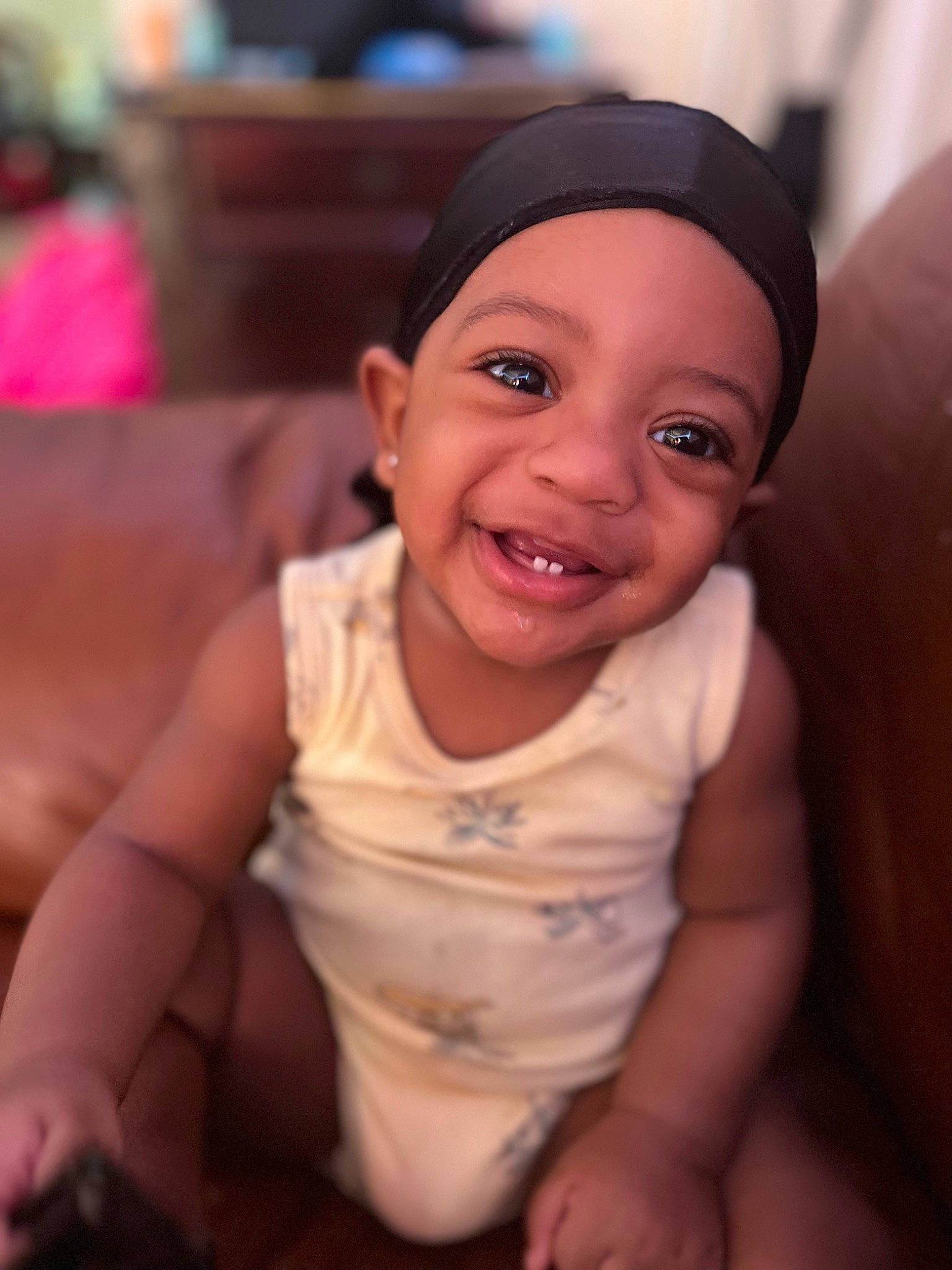 Kayden is registered to the contest to win money with this photo: baby_toddler_clothing, cheek, chin, dress, eye, eyebrow, finger, flash_photography, fun, gesture, happy, headwear, iris, joy, lip, mouth, neck, nose, person, skin