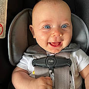 Isabelle is registered to the contest to win money with this photo: baby, infant, car_seat, harness, smiling, blue_eyes, clothing, cute, child, seatbelt, safety, chicco, happy, portrait, infant_hand, toddler, closeup, baby_girl, baby_boy, child_safety