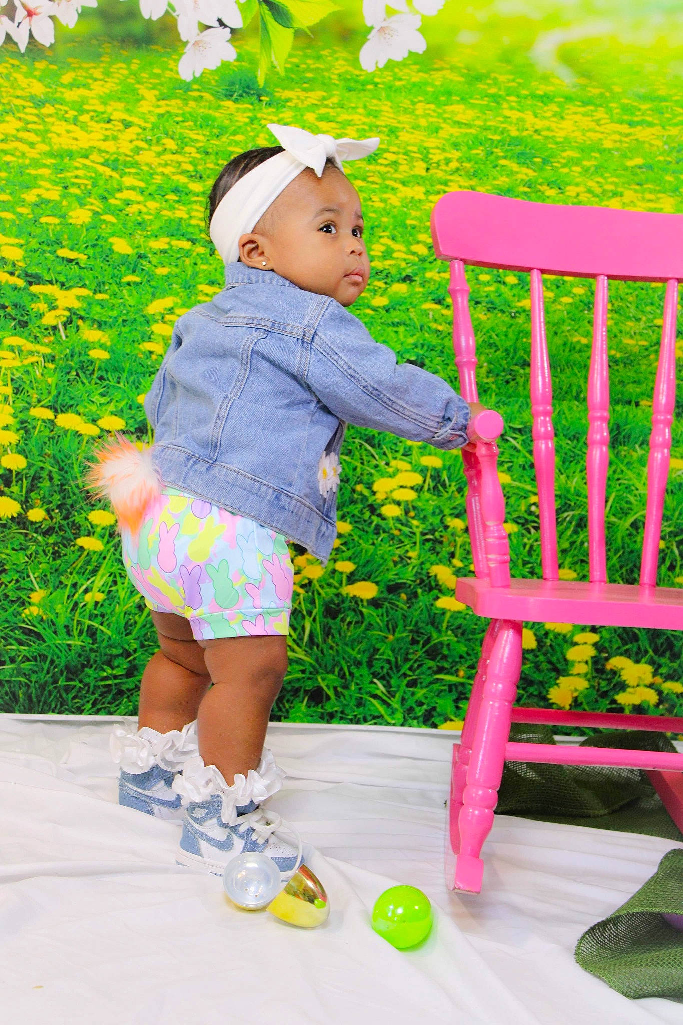 Dior is registered to the contest to win money with this photo: baby_toddler_clothing, chair, child, design, event, flower, fun, grass, green, happy, leisure, magenta, pattern, people_in_nature, person, pink, plant, purple, textile, toddler