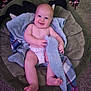 baby, infant, smiling, diaper, blanket, bed, carpet, indoor, child, happy, person, cute, soft, plush, playful, comfort, cozy, patterned, toddler, relaxed