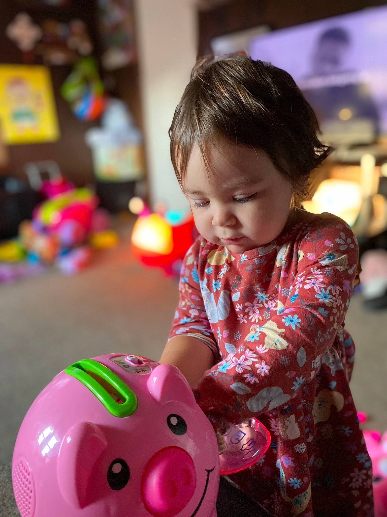 Lily is registered to the contest to win money with this photo: baby_playing_with_toys, baby_toddler_clothing, ball, child, event, facial_expression, fun, happy, holiday, leisure, magenta, people, person, photograph, pink, play, sitting, skin, sleeve, toddler