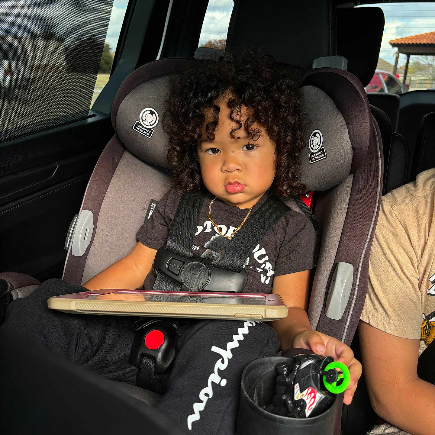 Jayveon is registered to the contest to win money with this photo: accessories, alloywheel, belt, car, car_interior, carseat, child, cushion, face, female, girl, head, homedecor, jewelry, necklace, person, photography, portrait, transportation, vehicle