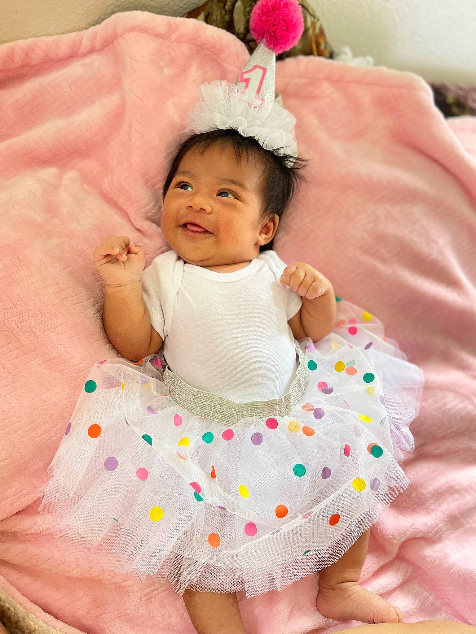 Kuuipomakamaeonalani joined the competition — help win amazing prizes! baby, baby_toddler_clothing, child, comfort, dress, finger, fun, happy, linens, mammal, pattern, people, person, pink, product, sitting, skin, sleeve, textile, toddler