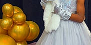 Toothfairy Daughter is registered to the contest to win money with this photo: child, girl, dress, tiara, gloves, balloons, gold, white_shawl, wooden_steps, formal_wear, portrait, indoor, event, celebration, fancy, elegant, person, young, fashion, cute