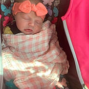 Paisley is registered to the contest to win money with this photo: baby, sleeping, blanket, headband, pink, butterfly_pattern, carrier, infant, child, soft_lighting, wrapped, cute, peaceful, resting, toddler, apparel, fabric, portrait, indoor, young_child
