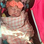 baby, sleeping, blanket, headband, pink, butterfly_pattern, carrier, infant, child, soft_lighting, wrapped, cute, peaceful, resting, toddler, apparel, fabric, portrait, indoor, young_child