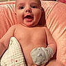 baby, infant, smiling, blanket, mitten, cushion, pink, skin, happy, face, mouth_open, lying_down, child, young, indoors, soft_texture, closeup, cute, person, comfort