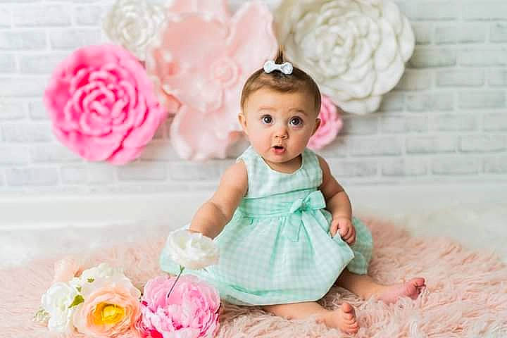 Miley joined the competition — help win amazing prizes! baby, baby_toddler_clothing, beauty, child, dress, flower, happy, headpiece, person, petal, photograph, pink, plant, product, rose, rose_family, rose_order, sleeve, surprise, textile