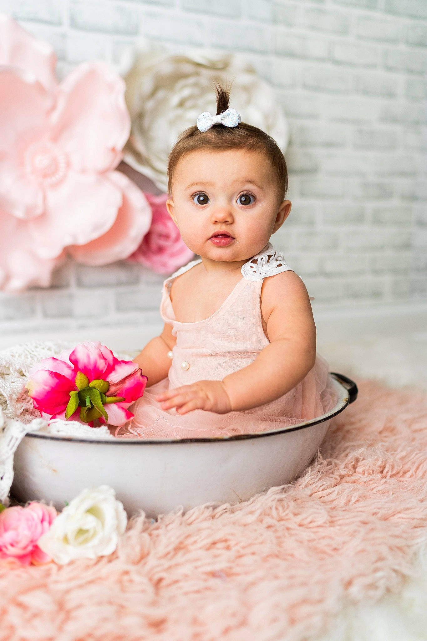 Miley joined the competition — help win amazing prizes! baby, baby_toddler_clothing, child, cut_flowers, event, fashion_accessory, flower, flower_arranging, hair_accessory, happy, headpiece, magenta, peach, person, petal, pink, rose, rose_family, sitting, surprise