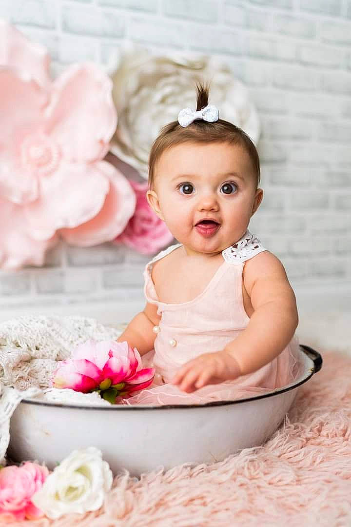 Miley joined the competition — help win amazing prizes! baby, baby_toddler_clothing, beauty, child, dress, face, flash_photography, flower, happy, headpiece, peach, person, petal, photograph, pink, product, skin, smile, surprise, textile