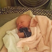 Julianna is registered to the contest to win money with this photo: newborn, baby, blanket, pink, mitten, pacifier, sleeping, face, bed, fan, comfort, cozy, indoor, rest, child, infant, soft, cushion, clothing, person