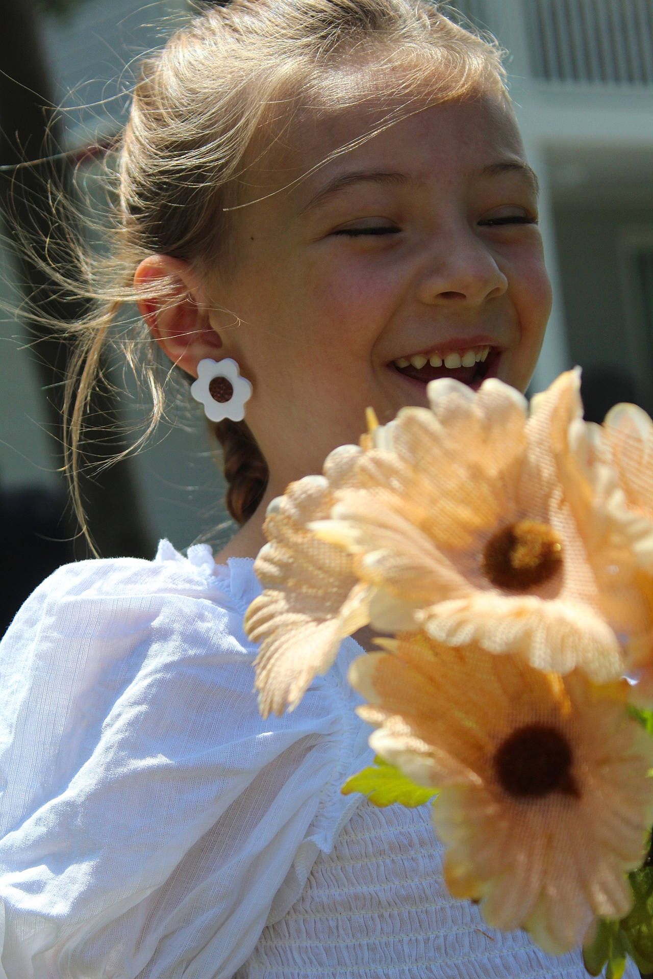 Gracelyn joined the competition — help win amazing prizes! annual_plant, artificial_flower, child, cut_flowers, event, eyelash, eyewear, flower, flower_arranging, flowering_plant, fun, happy, jewellery, peach, people_in_nature, person, petal, plant, pollen, smile