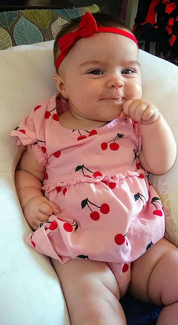 Alannah is registered to the contest to win money with this photo: baby, baby_products, baby_toddler_clothing, cheek, child, face, head, headgear, headwear, lip, mouth, person, pink, skin, sleeve, smile, toddler