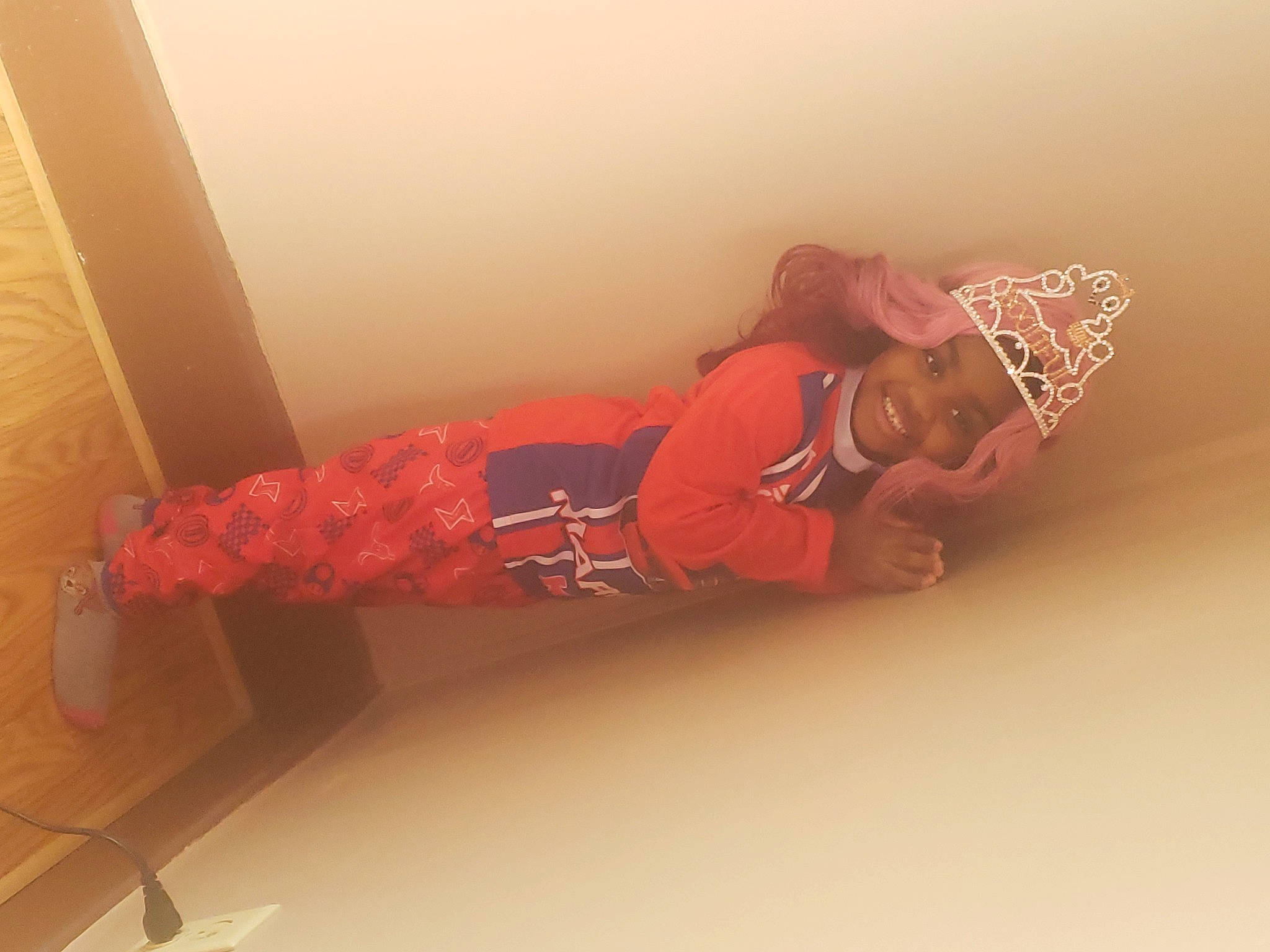 Myanna is registered to the contest to win money with this photo: bedding, carmine, comfort, elbow, flesh, flooring, hardwood, headwear, human_leg, joy, knee, linens, magenta, nap, peach, person, plaster, room, sitting, sock