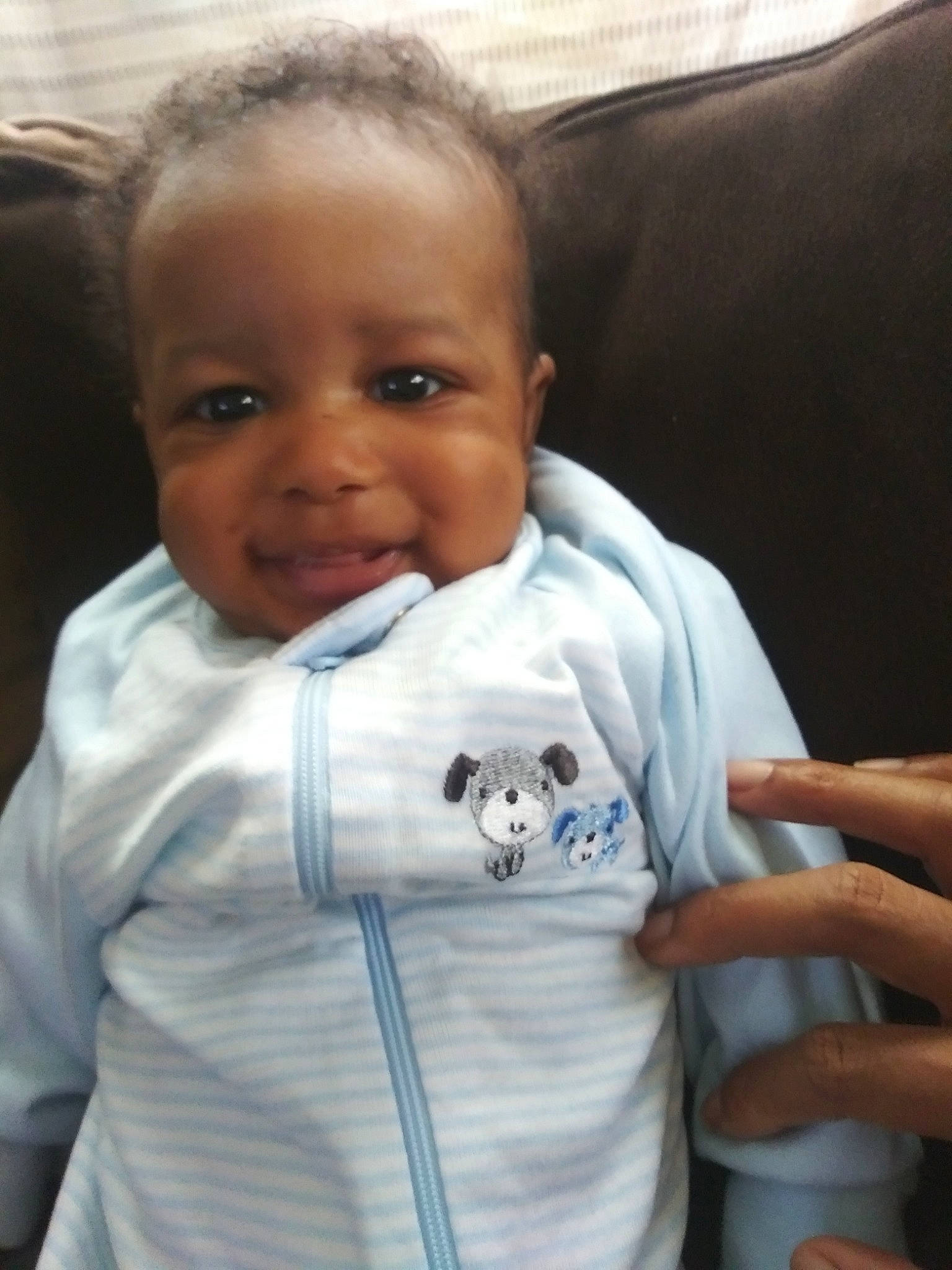 Kingdom is registered to the contest to win money with this photo: arm, baby, child, head, person, skin, smile, toddler