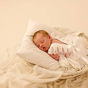 Margot joined the competition — help win amazing prizes! newborn, baby, sleeping, pillow, white_lace, blanket, soft_fabric, wooden_bowl, cozy, infant, portrait, resting, peaceful, wrapped, cute, delicate, indoors, closeup, baby_clothing, neutral_colors