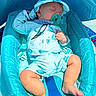 baby, sleeping, pacifier, hat, blue_outfit, infant, baby_seat, comfort, child, cute, sunlight, resting, peaceful, legs, hand, headwear, soft_fabric, indoors, relaxation, infant_clothing