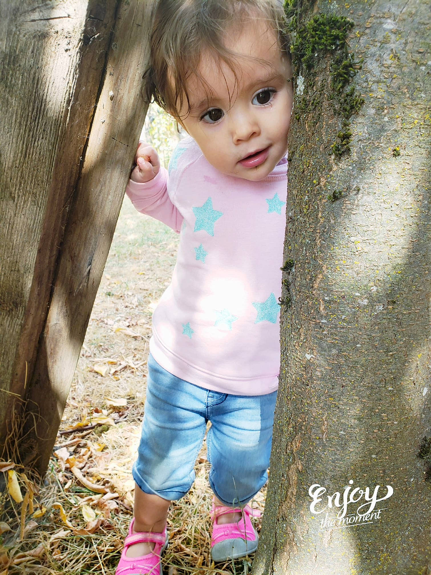 Ohannah is registered to the contest to win money with this photo: child, eye, fun, girl, grass, jeans, person, pink, play, skin, toddler, tree