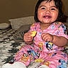 toddler, child, smiling, pajamas, indoor, bed, blanket, fruit, pineapple, happy, cute, sitting, person, clothing, face, sock, hair, skin, room, cozy