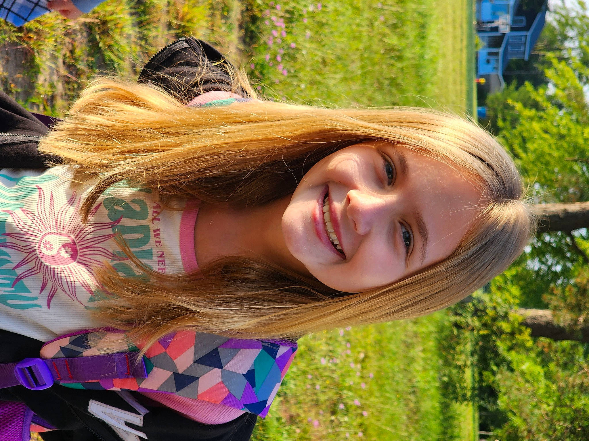 Kaylen is registered to the contest to win money with this photo: bangs, blond, brown_hair, child, eye, fashion_accessory, fawn, fun, grass, hairstyle, happy, joy, leisure, long_hair, pattern, people_in_nature, person, plant, recreation, smile