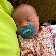 Marilynn Jo joined the competition — help win amazing prizes! baby, newborn, pacifier, sleeping, infant, pink_clothing, floral_pattern, face, head, closed_eyes, soft_skin, cuddle, blanket, comfort, peaceful, child, portrait, indoors, human, resting
