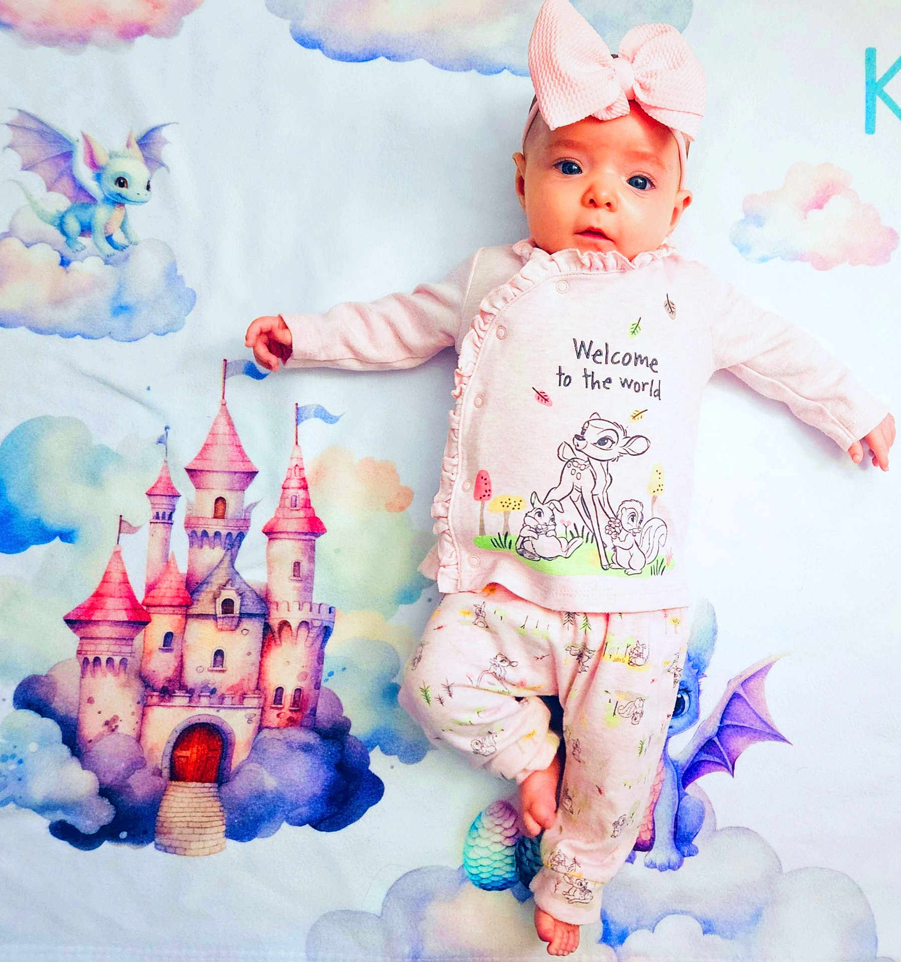 Karina joined the competition — help win amazing prizes! baby, infant, headband, bow, onesie, blanket, castle, clouds, dragon, pastel_colors, pink, blue, newborn, portrait, lying_down, illustration, patterned_clothing, cute, nursery, feet
