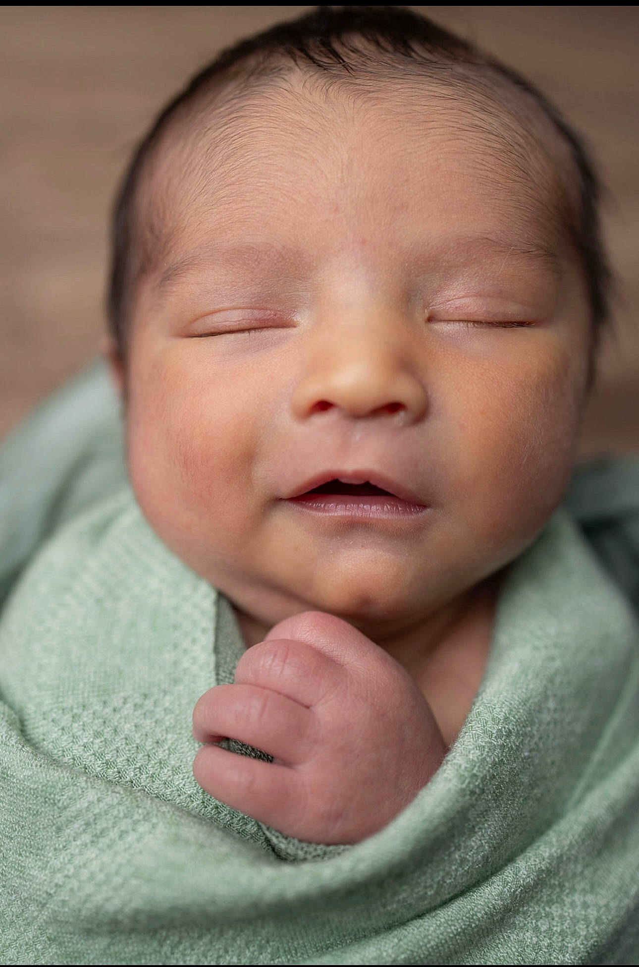 Fisher is registered to the contest to win money with this photo: baby, baby_toddler_clothing, cheek, child, close_up, comfort, eyebrow, eyelash, gesture, happy, iris, lip, mouth, nose, person, portrait_photography, skin, sleeve, smile, thumb
