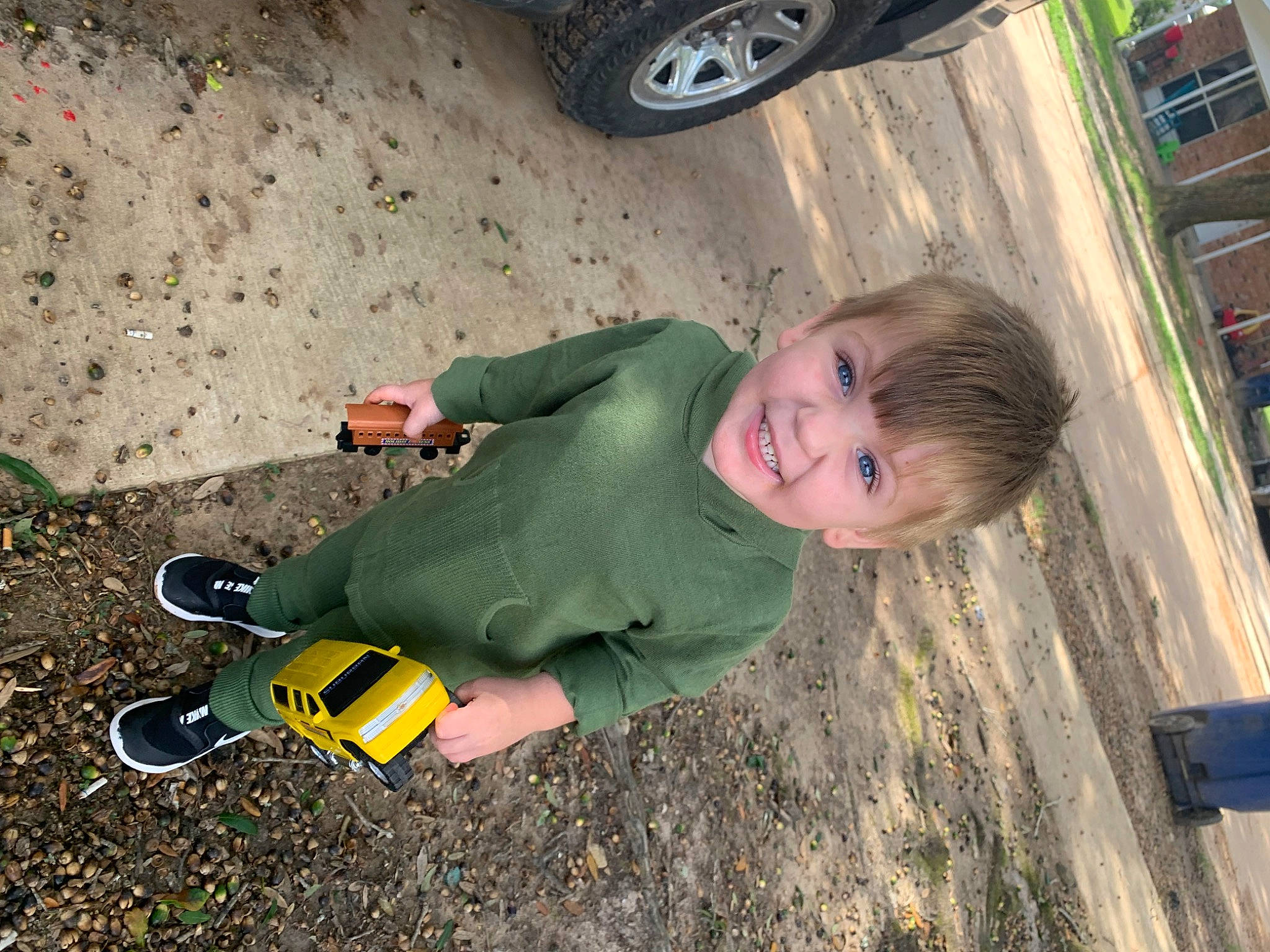Calum joined the competition — help win amazing prizes! asphalt, automotive_tire, fender, fun, high_visibility_clothing, joy, motor_vehicle, people_in_nature, person, personal_protective_equipment, road_surface, shoe, smile, synthetic_rubber, tire, tire_care, toddler, toy, tread, vehicle