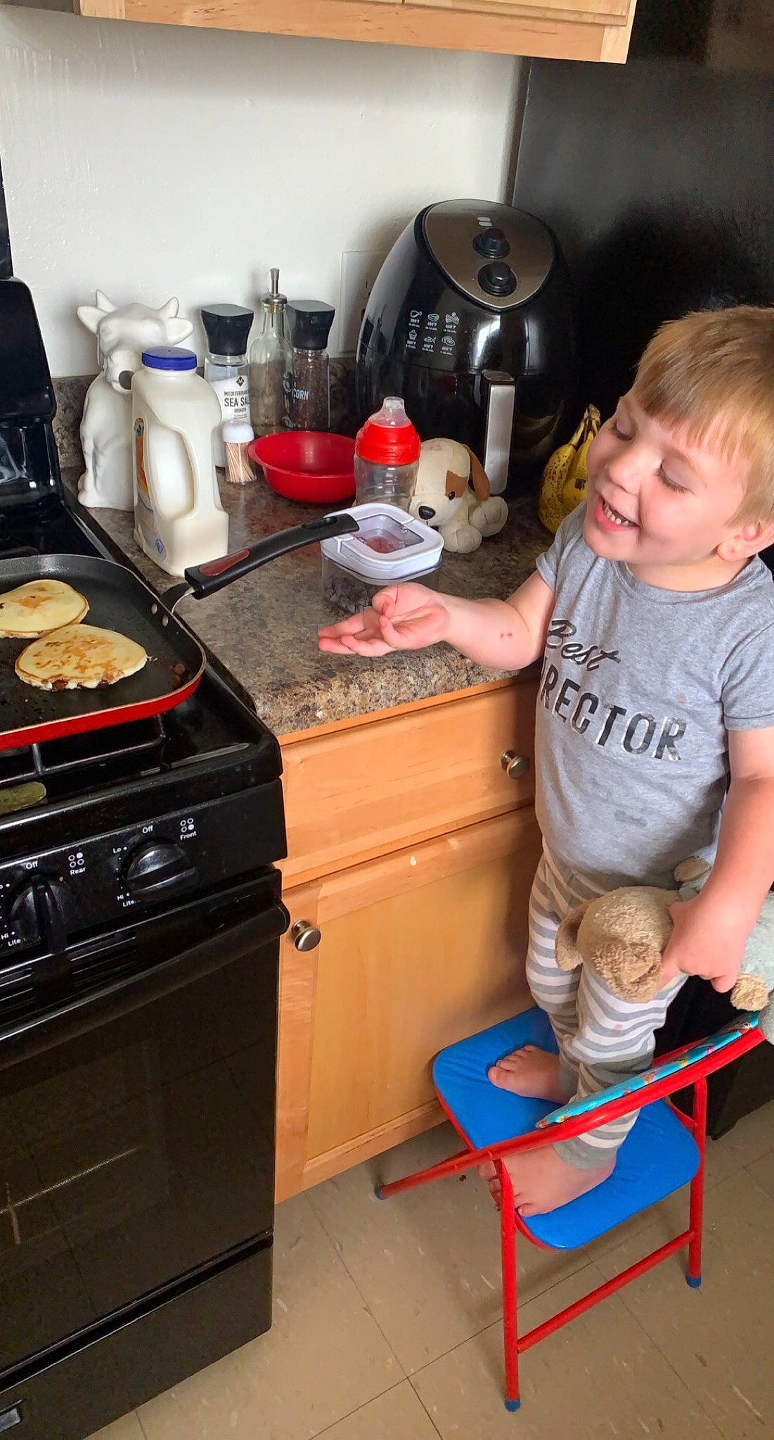 Calum is registered to the contest to win money with this photo: cabinetry, coffeemaker, cooking, cooktop, cookware_and_bakeware, countertop, food, gas_stove, home_appliance, kettle, kitchen, kitchen_appliance, kitchen_stove, major_appliance, microwave_oven, person, recipe, smile, stove, stovetop_kettle