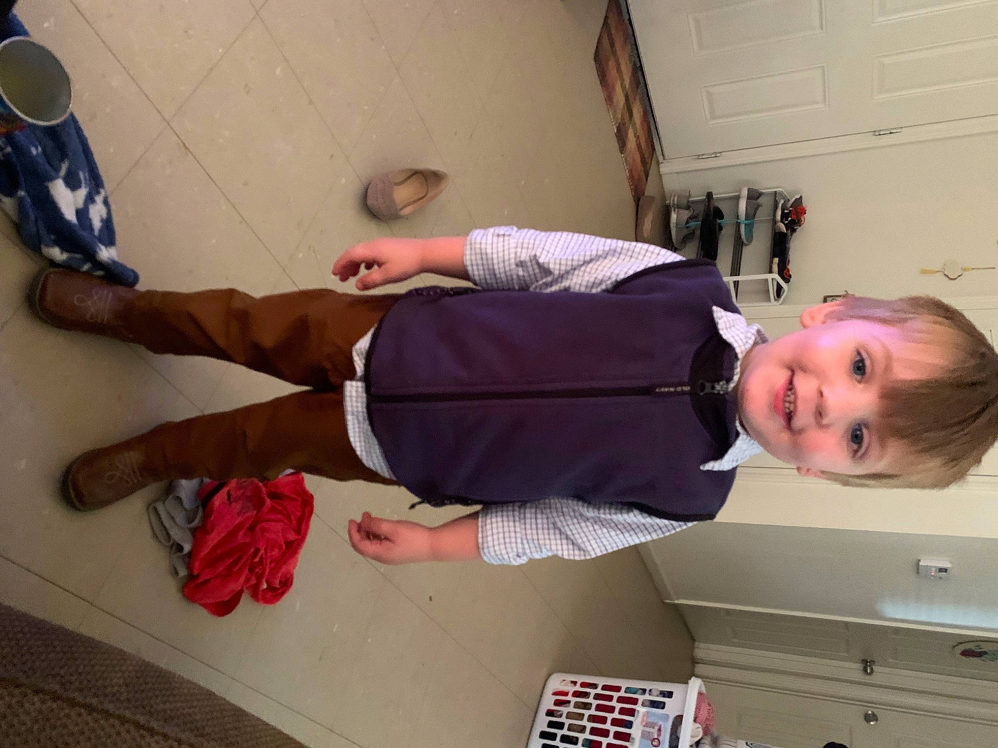 Calum is registered to the contest to win money with this photo: arm, baby_toddler_clothing, cabinetry, drawer, elbow, finger, flooring, fun, human_leg, joint, joy, knee, leg, people, person, shoulder, smile, sneakers, thigh, toddler