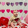 baby, infant, child, heart, hearts, valentines_backdrop, heart_sweater, sweater, balloon, red_balloon, pink_balloon, confetti, red_confetti, sitting, portrait, cute, studio_setup, decorations, celebration, backdrop